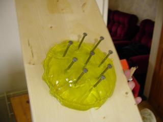 Jelly with nine nails in it
