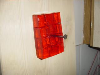 Orange jelly nailed to the wall